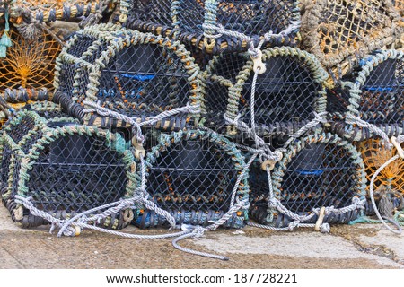 Stacked fishermans  lobster pots close up Folkestone harbour, Kent, UK