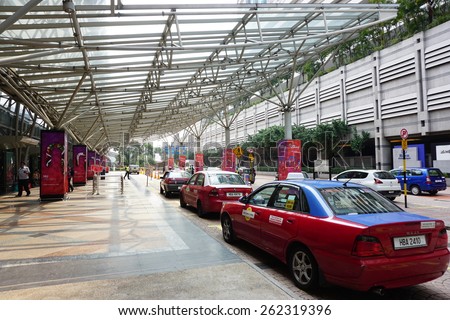 Bangsar, KUALA LUMPUR - March 21, 2015: Taxis lined up waiting to take passengers at KL Sentral, KUALA LUMPUR. Taxis and rental cars rose between 20 and 67 per cent with immediate effect.
