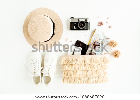 Woman fashion travel. Straw hat, bag with accessories, sneakers, retro camera, sunglasses. Flat lay. Top view