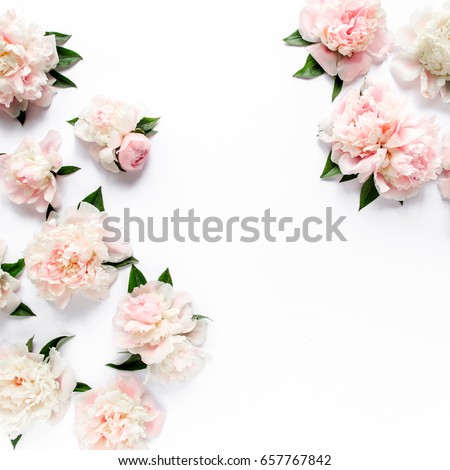 Floral frame wreath made of pink and beige peonies flower buds, eucalyptus branches and leaves isolated on white wooden background. Flat lay, top view. Frame of flowers.