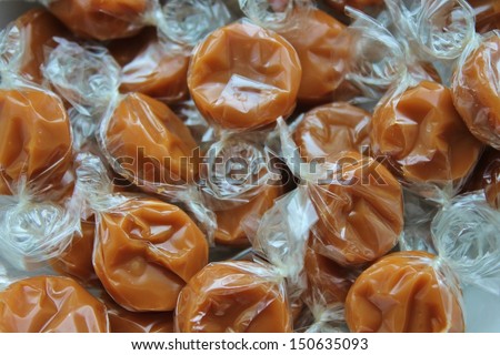 Yummy chewy toffee caramels in wrapper ready to grab
