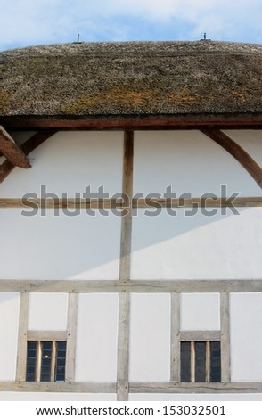 The Medieval style Shakespeare Globe theatre in London window detail