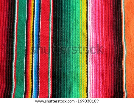 mexican traditional handwoven rug poncho fiesta with stripes and bright colors