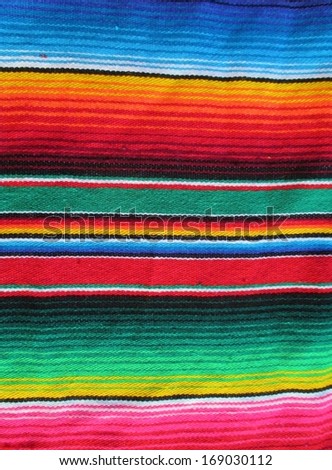 mexican traditional cinco de mayo rug poncho fiesta with stripes and bright colors