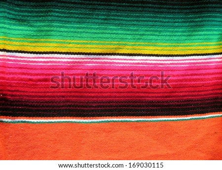 Mexico poncho fiesta with stripes and bright colors background
