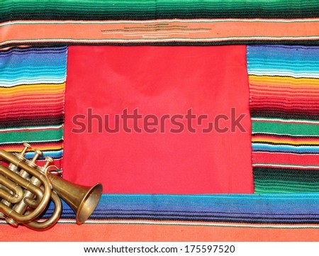 frame Mexican fiesta poncho rug  in bright colors with sombrero background with copy space