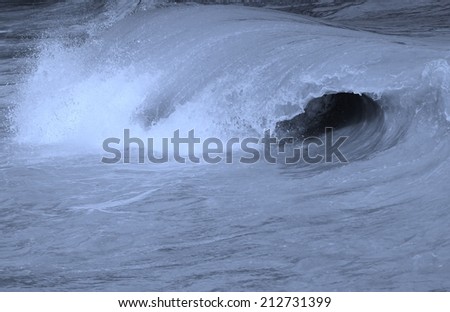 Ocean surf Wave Barrel curling before crashing