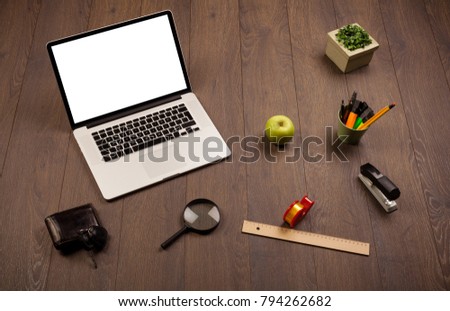 Business wooden desk with office supplies and modern laptop white background