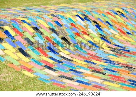 on the lawn design with color tiles floor