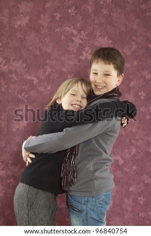 Portrait of two happy brothers hugging and smiling