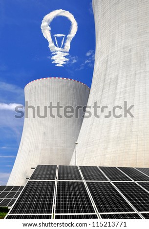 Solar energy panels before a nuclear power plant and bulb from clouds