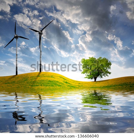 spring landscape with wind turbine in the sunset