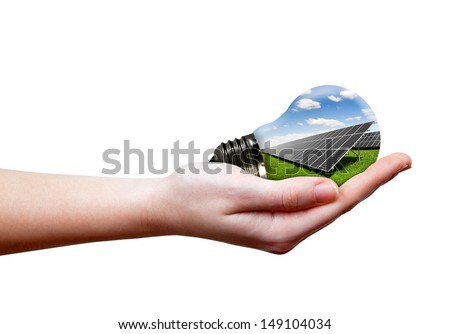 Bulb with of solar panel in hand isolated on white
