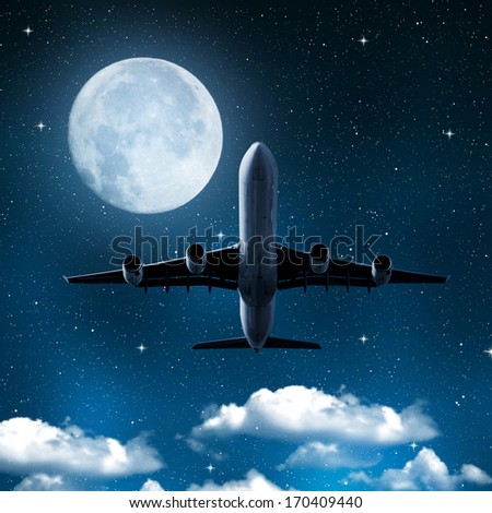 aircraft on night sky with moon