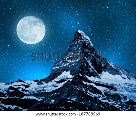 Matterhorn in night sky with moon - Swiss Alps