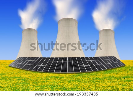 Solar energy panels before a nuclear power plant