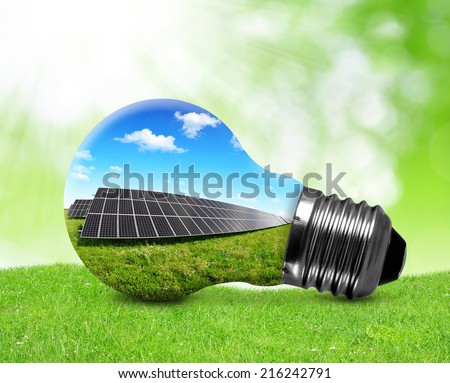 Solar panels in light bulb. Green energy concept.