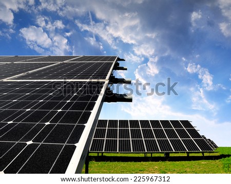 Solar energy panels against sunset sky