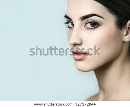 Beauty model with natural nude make up, fresh skin.  Youth and Skin Care Concept.  Make up and Hair.  Close up, selected focus.