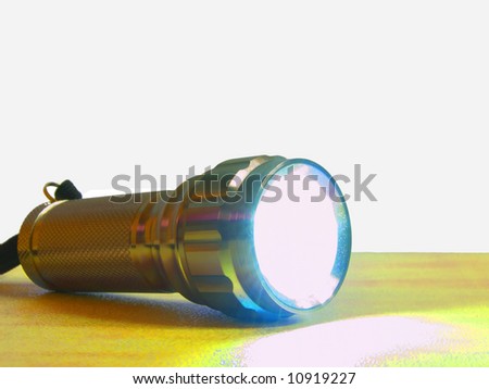 Multicolored light reflecting off a metal torch
