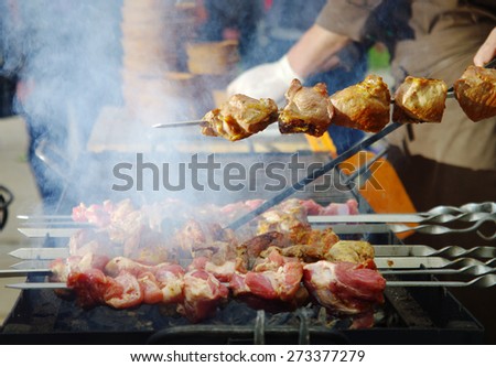 cooking meat over a fire in the restaurant