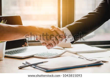 Partners corporate relationship concept. Close up handshake of business people in meeting attendance.