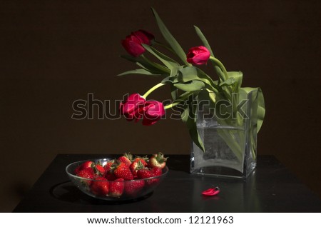 Bouquet of tulips and strawberry