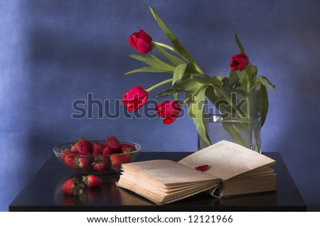 Bouquet of tulips, strawberry and the book
