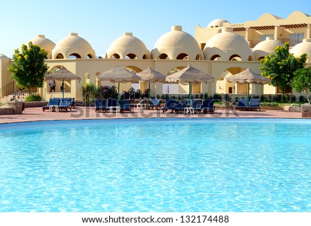 Sunbeds near swimming pool at luxury hotel, Sharm el Sheikh, Egypt