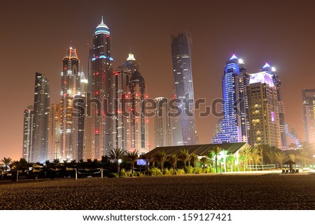Beach in night illumination at the luxury hotel, Dubai, UAE