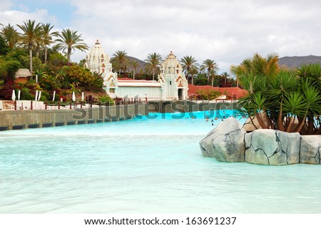 TENERIFE ISLAND, SPAIN - MAY 22: The tourists enjoying artificial wave water attractions in Siam waterpark on May 22, 2011 in Tenerife, Spain. The Siam is the largest water theme park in Europe.