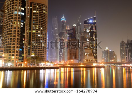 The night illumination at Dubai Marina and Cayan Tower,  Dubai, UAE