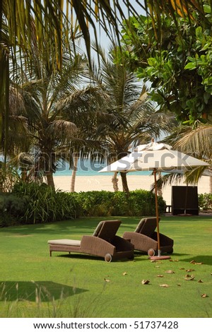 Luxurious hotel recreation area with modern deck chairs, Dubai, United Arab Emirates