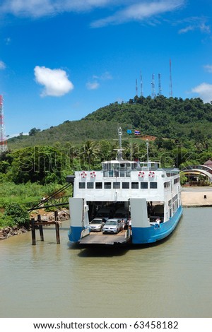 TRAT, THAILAND - SEPTEMBER 5: The Koh Chang ferry pier and ferry going to Koh Chang island on September 5, 2010 in Trat, Thailand. The ferry transports thousands passengers daily