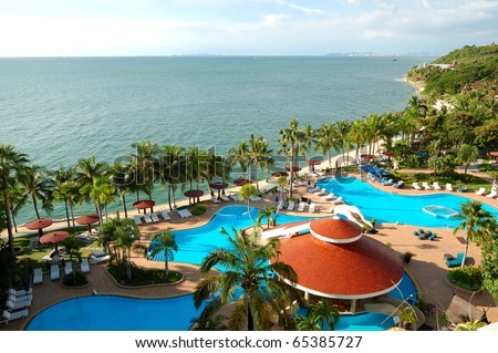 Swimming pools and bar at the beach of luxury hotel, Pattaya, Thailand