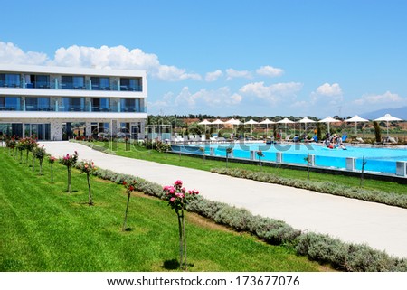 PELOPONNES, GREECE - JUNE 8: The tourists enjoying their vacation at luxury hotel on June 8, 2013 in Peloponnes, Greece. Up to 16 mln tourists is expected to visit Greece in year 2013.