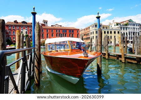 VENICE, ITALY - JUNE 16: The parked water taxi for tourists transportation is on Grand Canal on June 16, 2014 in Venice, Italy. More then 46 mln tourists is expected to visit Italy in year 2014.