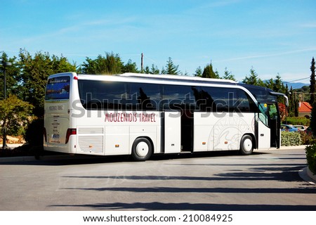 KASSANDRA, GREECE - APRIL 26: The modern bus for tourists transportation is near entrance to hotel on April 26, 2012 in Kassandra, Greece. 11,3 million tourists have visited Greece in year 2012