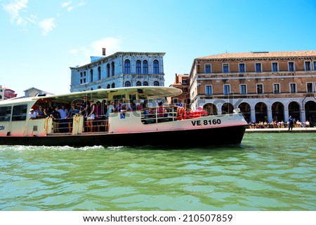 VENICE, ITALY - JUNE 16: The passenger ship with tourists is on Grand Canal on June 16, 2014 in Venice, Italy. More then 46 mln tourists is expected to visit Italy in year 2014.
