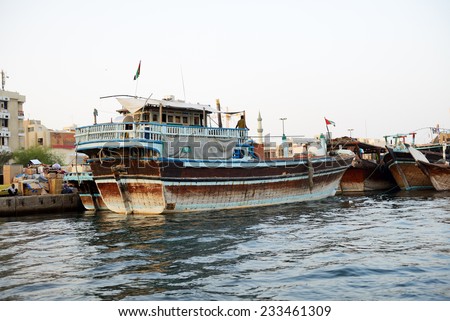 DUBAI, UAE - SEPTEMBER 10: The traditional cargo ship in Dubai Creek on September 10, 2013 in Dubai, United Arab Emirates. In city of artificial channel length of 3 kilometers along the Persian Gulf.