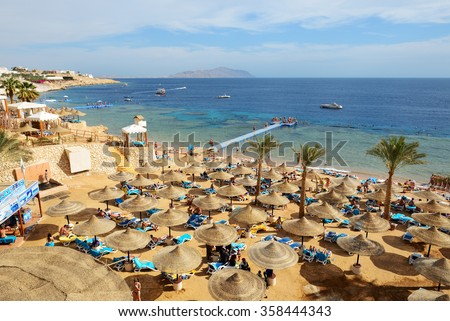 SHARM EL SHEIKH, EGYPT -  NOVEMBER 30: The tourists are on vacation at popular hotel on November 30, 2013 in Sharm el Sheikh, Egypt. Up to 12 million tourists have visited Egypt in year 2013.