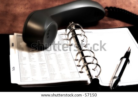 Photo of a Phone and Appointment Book.