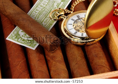Photo of a Cigar Box and Pocket Watch