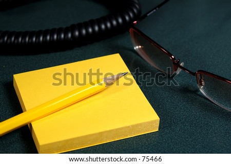 Memo Pad and Pencil on a Desk