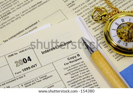 Tax Papers and Pocket Watch.  Tax Time Concept