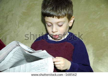 Child Reading Paper