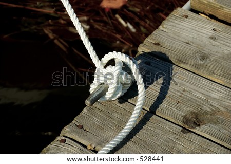 Photo of a Roped Tied Off To a Dock.