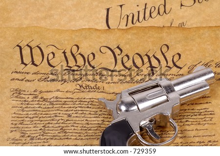 Declaration of Independence and a Gun.  RIght To Bare Arms Concept.