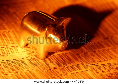 Photo of a Piggy Bank and Stock Quotes