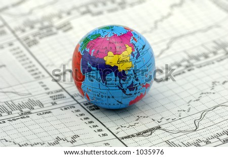 Global Markets Concept - Stock Charts and a Globe
